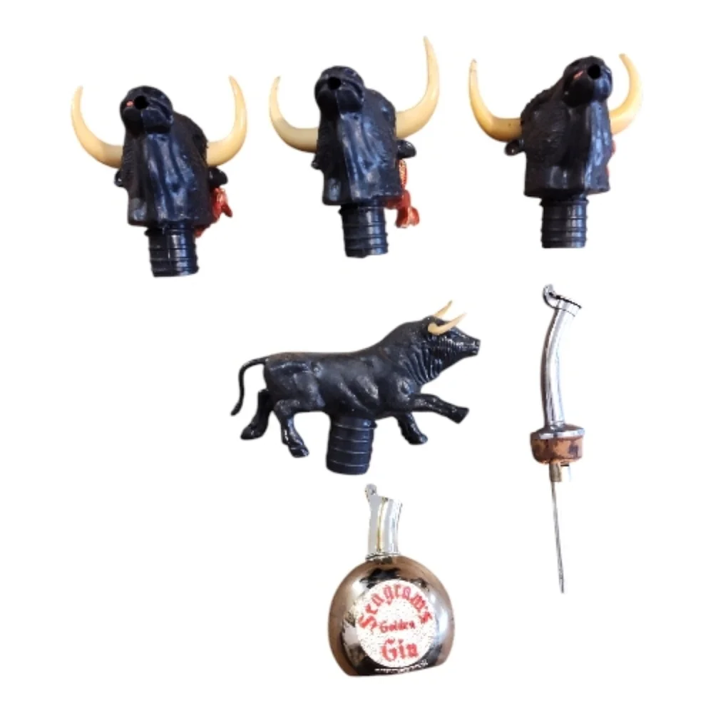 Lot Of vintage plastic bull head bottle pourer and stopper